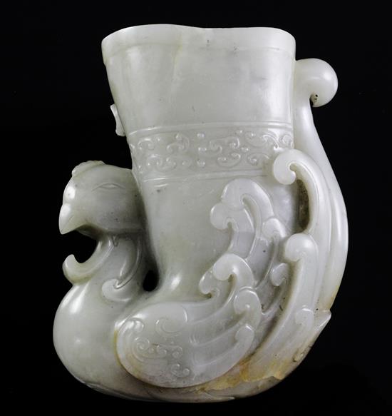 A Chinese archaistic pale celadon jade phoenix rhyton, height 10.2cm